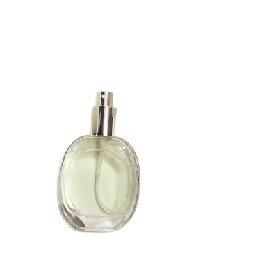 Bouteille de parfum en verre en forme d' oblate Bouteille ronde transparente Bouteille à pulvérisation portable